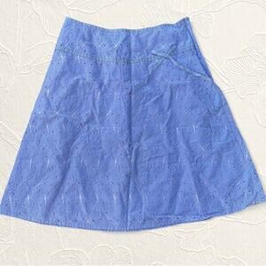 Lavender embroidered midi skirt with bow detail.